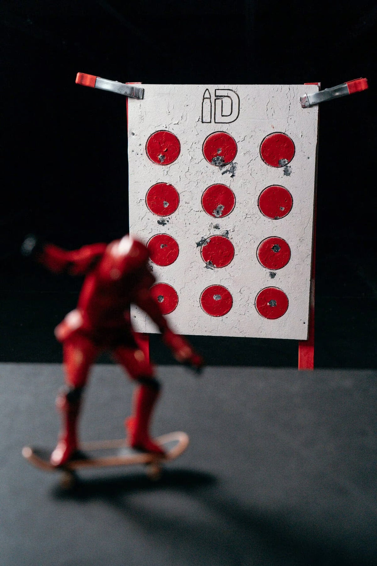 Shooter working a pistol shooting stance on an Infinity Targets self healing rubber target at the range