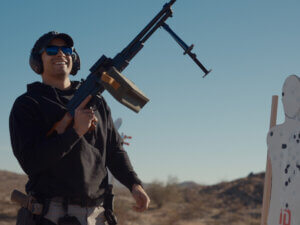Holding a full auto PKM build by AK Mario and SOF Defense